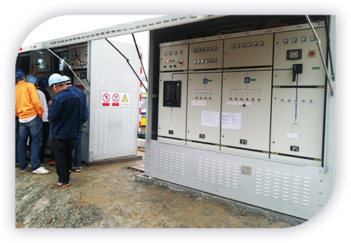 Technicians working on a control cabinet