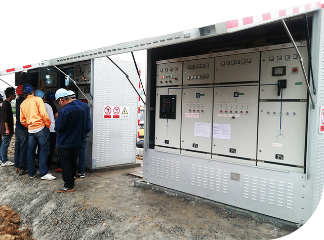 Engineers Inspecting Prefabricated Substation Equipment On Site